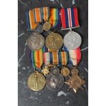 TWO GROUPS OF FIRST & SECOND WORLD WAR MEDALS AWARDED TO TWO FAMILY MEMBERS, comprising Victory