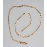 A 9CT BI-COLOUR GOLD ALBERTINA CHAIN, the twelve plain white bars with fancy links between and dog