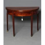 A GEORGIAN MAHOGANY FOLDING CARD TABLE, late 18th century, of demi lune form lined in red baize,