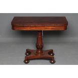 AN EARLY VICTORIAN MAHOGANY FOLDING TEA TABLE, the rounded oblong swivel top and plain frieze on