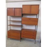 A STAPLES LADDERAX TEAK THREE SECTION MODULAR ROOM UNIT, comprising a pair of three drawer chests, a