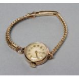 A LADY'S 9CT GOLD TUDOR ROYAL WRISTWATCH, the white dial with applied gilt metal Arabic numerals,