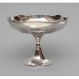 A TAZZA, maker Adie Bros., London 1922, the panelled circular bowl with reeded undulating rim raised