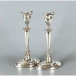 A PAIR OF CANDLESTICKS, maker Frank Cobb, Sheffield 1937, of eliptical form with detachable drip