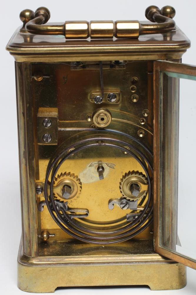 A BRASS CASED CARRIAGE CLOCK, the twin barrel movement with platform escapement striking on a - Image 2 of 4