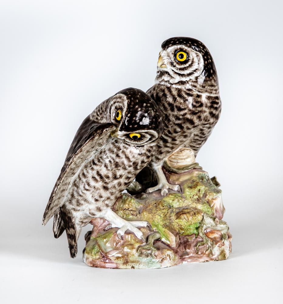 TWO MEISSEN PORCELAIN OWLS, 19th century, both perched upon a naturalistically moulded rocky outcrop