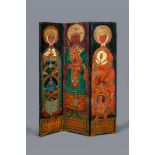 AN ARTS AND CRAFTS THREE FOLD PAINTED SCREEN painted in the Orthodox Church style with a full length