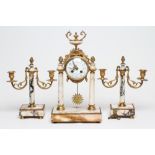 A FRENCH VEINED WHITE MARBLE AND GILT METAL PORTICO GARNITURE, 19th century, the eight day