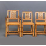 A SET OF SIX ROBERT THOMPSON OAK DINING CHAIRS including two elbow chairs, the lattice back over