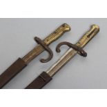 TWO FRENCH MODEL 1866 YATAGHAN SWORD BAYONETS, both with 22 1/2" blades dated 1874, steel scroll