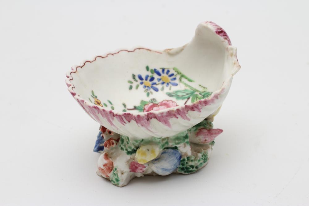 A BOW PORCELAIN SHELL SALT, c.1765, centrally painted in famille rose enamels with a large peony,