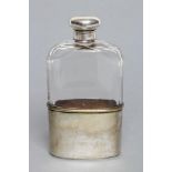 A CLEAR GLASS HIP FLASK, with panel cut upper section, silver screw on cover, maker's mark C/G?&A,