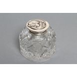 A LATE VICTORIAN CLEAR GLASS INKWELL, maker Wm. Hutton & Sons, London 1901, the plain mount with