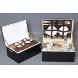 TWO GARRISON PICNIC HAMPERS, in tin boxes with fitted interiors including high quality eating and