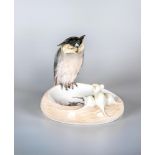 A ROYAL COPENHAGEN PORCELAIN DISH, 1938, modelled as an owl perched upon the rim perusing three