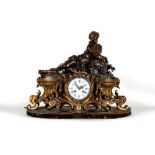 A FRENCH PATINATED AND GILT BRONZE MANTEL CLOCK, late 19th century, the eight day movement