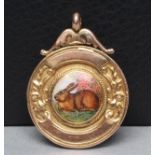 A 9CT GOLD FOB centred by a roundel enamelled with a rabbit, the reverse engraved "E.A.F. & F.S.