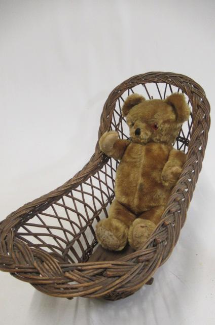 A vintage teddy bear, with sewn nose, amber eyes, orange plush, grey plush pads and swivel joints,