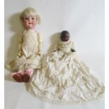Two Armand Marseille dolls, comprising a 19 3/4" bisque socket head doll with blue glass sleeping