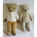 A pre-war Chad Valley teddy with amber eyes, cream cardigan, felt pads and sewn nose, 18 1/2",