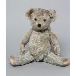 A rare blue teddy, possibly Farnell, with thick plush, cloth pads and clear/black eyes, 14" long (