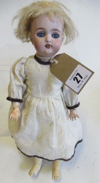 A Simon & Halbig bisque socket head doll, with blue glass sleeping eyes, open mouth, blond wig,