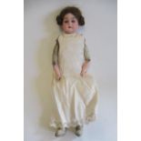 An Armand Marseille bisque shoulder head doll, with blue glass sleeping eyes, open mouth, teeth,