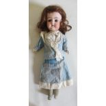 A German bisque socket head doll, with blue glass fixed eyes, open mouth, teeth, moulded eyebrows,