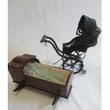 A Victorian style dolls pushchair, with basket enclosed seat, canvas cover and wood and metal frame,