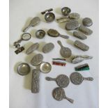 A tin of dolls dressing table items, including brushes, mirrors, bowls and an EPNS pusher (Est. plus