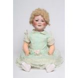 A Schoenau & Hoffmeister Princess Elizabeth bisque socket head doll, with blue glass sleeping