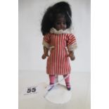 A possible Kammer & Reinhardt bisque socket head dolls house mulatto doll, with brown glass sleeping