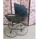 A French pram, with wooden body painted in blue and decorative gold, matching cloth canopy, turned