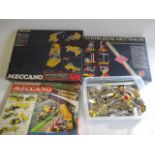 Three modern issue Meccano sets and a large quantity of Silver Strip Meccano pieces, sets are