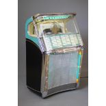 A Wurlitzer hi-fi juke box, with chrome metal mounts, button selectors, glazed top revealing