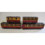 Four well made wooden 45mm narrow gauge coaches finished in red/yellow, brake van has regulator
