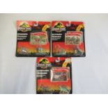 Three packs of Jurassic Park dinosaurs with Movie Collector cards, slight damage to packets,