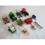 Britains Farm vehicles comprising four Late Issue tractors, trailers, ploughs and boilers, F-E (Est.
