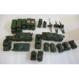 Twenty four Dinky military vehicles including tank transporters and tanks, 10 ton trucks, guns and