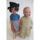 Two Armand Marseille bisque socket head dolls, comprising a 341 2 1/2K baby doll with brown glass