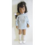A Sasha doll, with hard vinyl jointed body, brown eyes, black hair, leather shoes, straw boater
