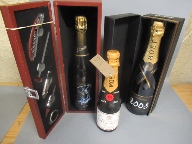 Three bottles of champagne, comprising a 50cl 1966 Moet & Chandon dry imperial, a boxed 2008