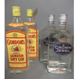Two bottles of vintage Gordon's special London dry gin, together with two bottles Crown Jewel