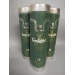Three bottles Glenfiddich 12 year old signature malt whisky, all in leathered tubes (Est. plus 21%