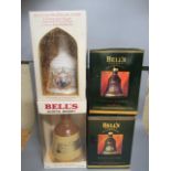 Four Bells Whisky decanters, comprising two Christmas Decanters, a Specially Selected decanter and a