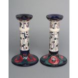 A PAIR OF MOORCROFT POTTERY MACKINTOSH PATTERN CANDLESTICKS, modern, tubelined and painted in