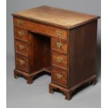 A GEORGIAN MAHOGANY KNEEHOLE DRESSING TABLE/DESK, third quarter 18th century, the moulded edge top