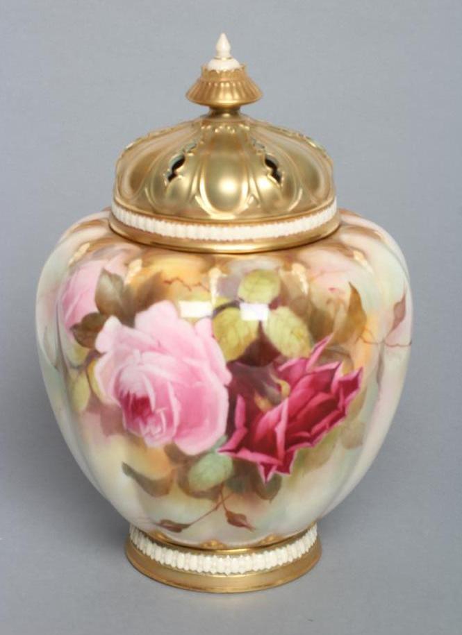 A ROYAL WORCESTER CHINA POT POURRI VASE AND COVERS, 1912, of melon fluted form painted in polychrome