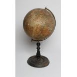 A GEOGRAPHICA LTD. LONDON 10" TERRESTRIAL GLOBE, mounted on a brass half meridian, on turned