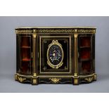 A VICTORIAN EBONISED CREDENZA of D form with gilt metal mounts, the central door with oval pietra